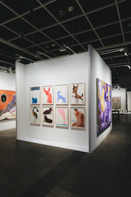 Art gallery displays various colorful animal paintings.