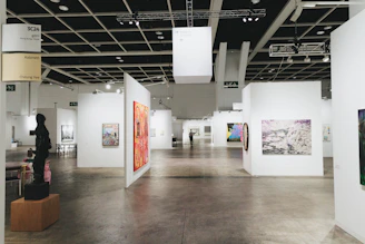 Modern art gallery with many paintings.