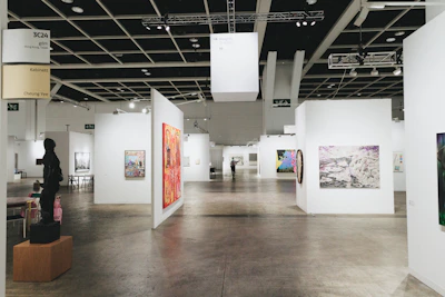 Modern art gallery with many paintings.