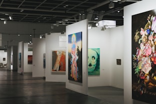 An art gallery showcases various paintings on display.