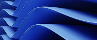 Blue, wavy abstract shapes in close up.
