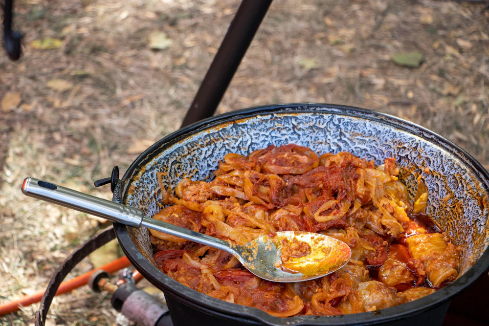 Stew of meat and vegetables simmering in a large pot
