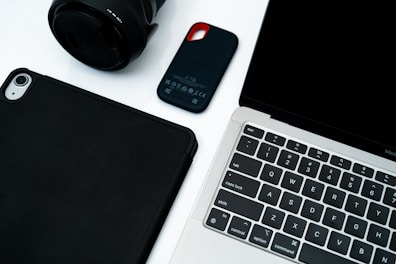 Electronic devices arranged on a white surface.
