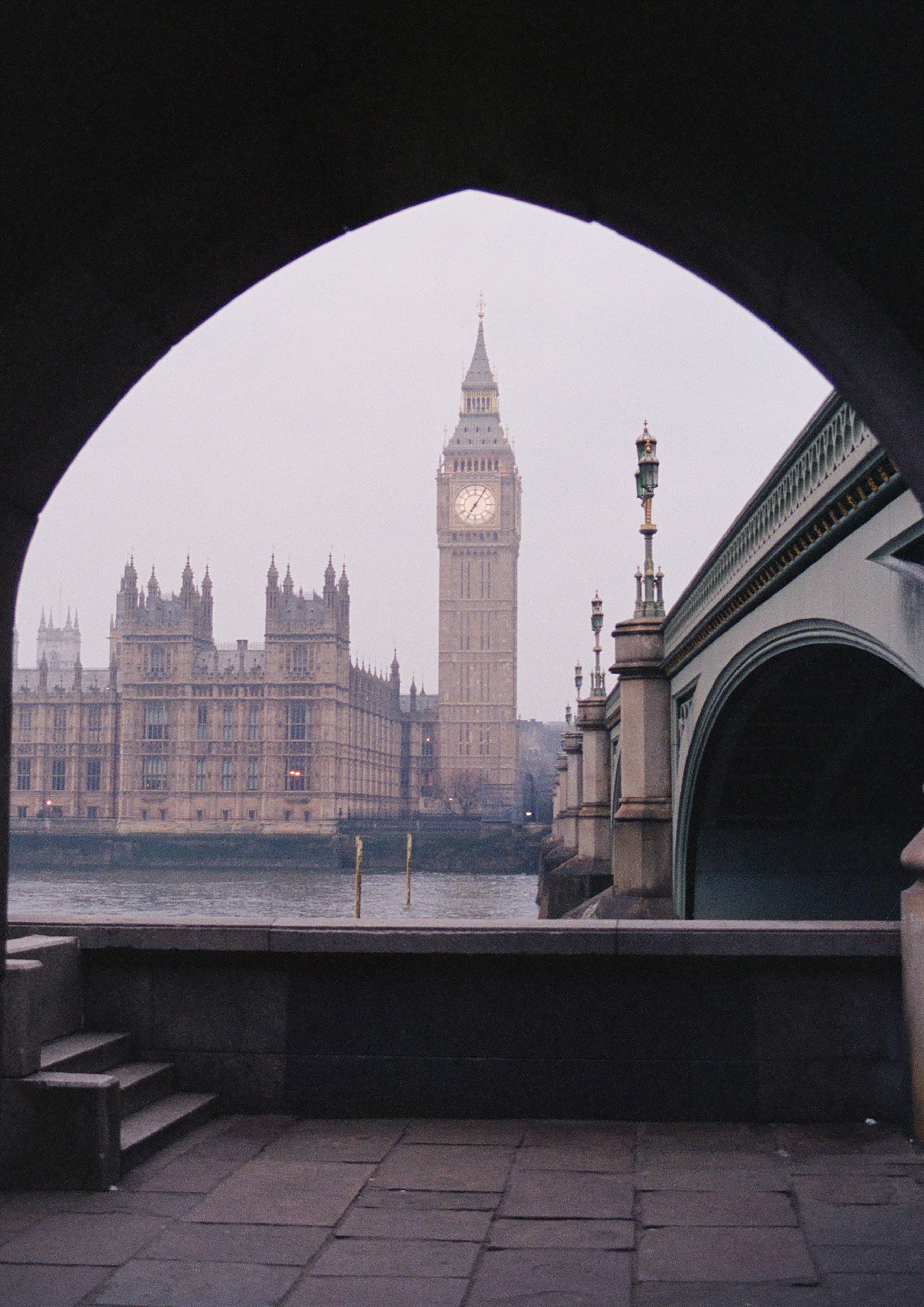 Big ben and the houses of parliament framed by an arch.