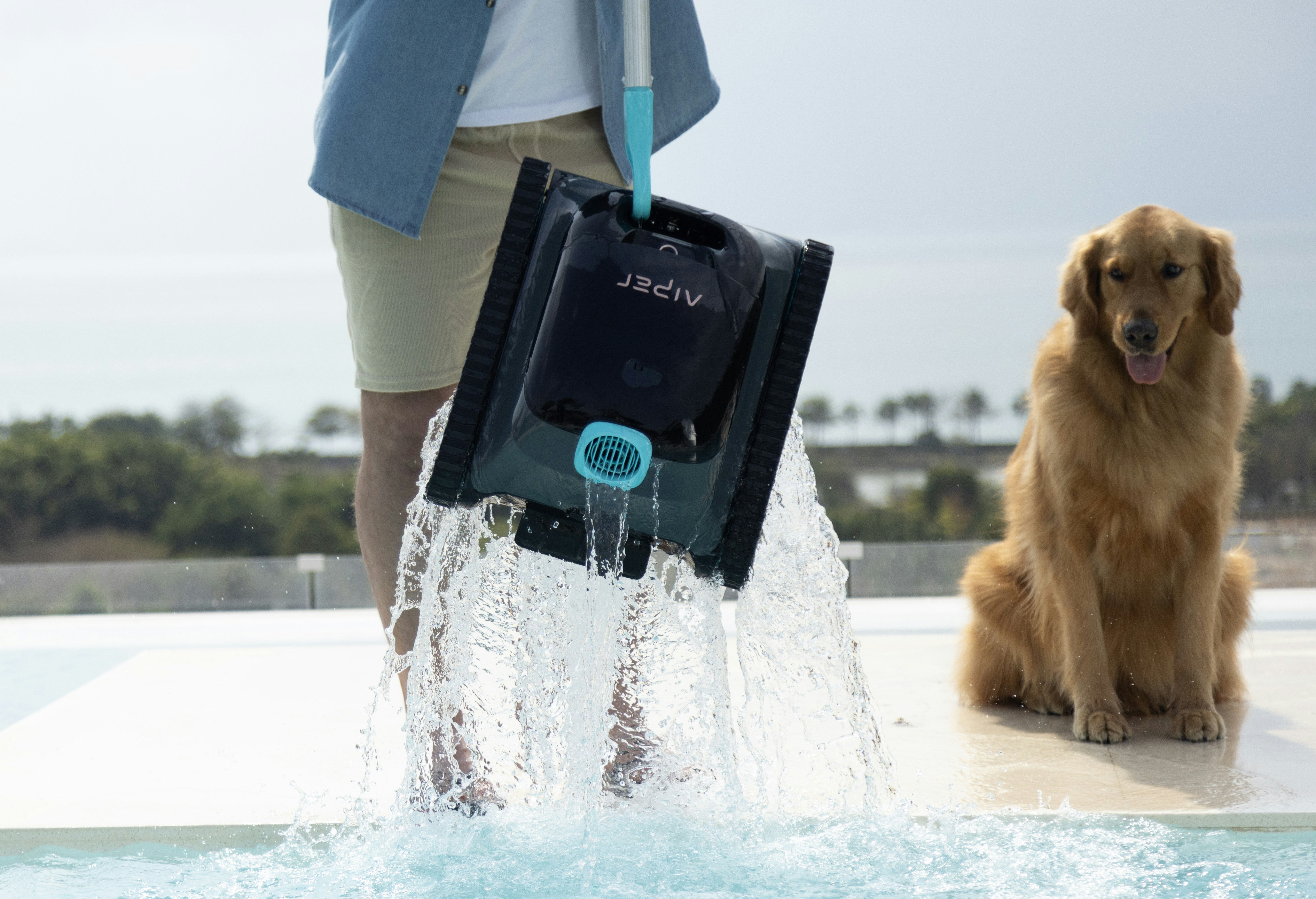 A person empties water from a pool cleaner.