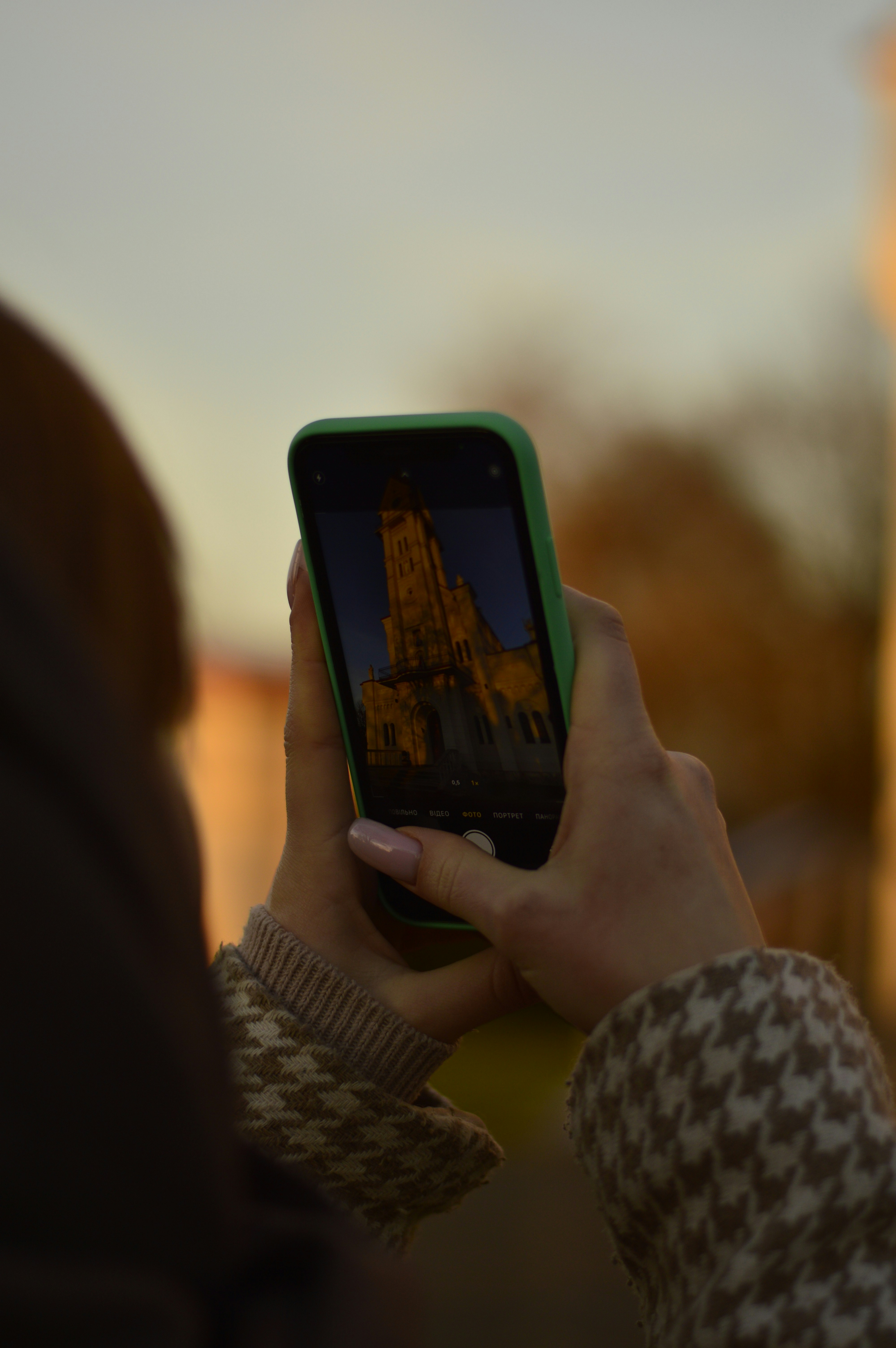 Someone is taking a photo of a building