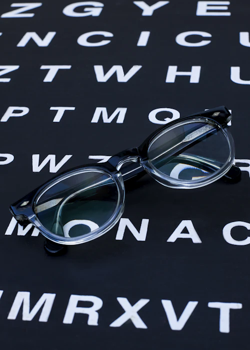 Eyeglasses resting on a Snellen eye chart