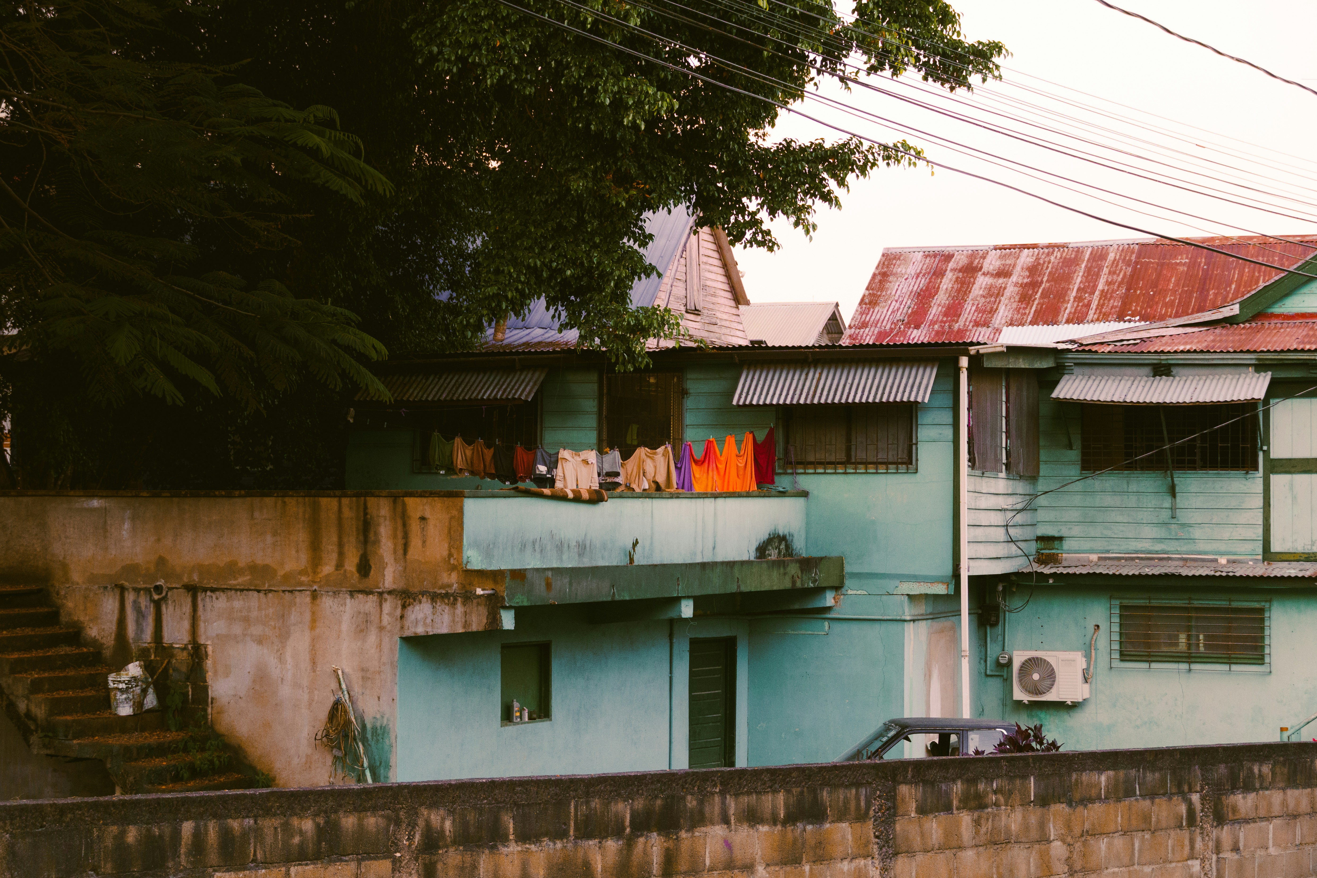 Houses are shown with laundry drying outside