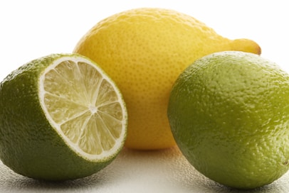 Lemons and limes are together in the shot.