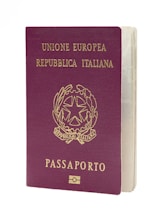 Here is the caption: italian passport is shown on a white background.