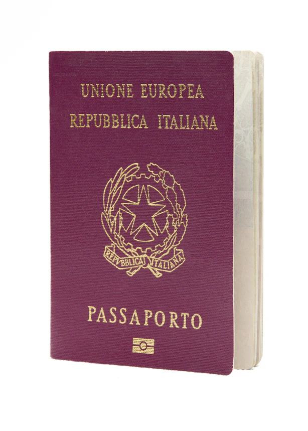 Here is the caption: italian passport is shown on a white background.