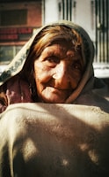 An elderly woman with a gentle smile.
