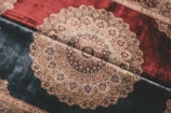 Detailed pattern on two different colored rugs.