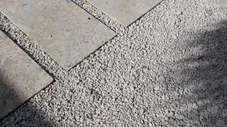 Stone pavers with gravel fill a pathway.