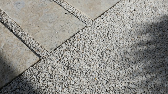 Stone pavers set into pale gravel