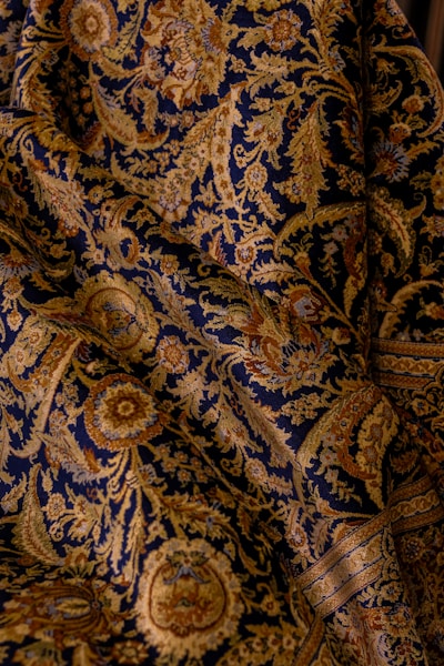 The fabric shows intricate paisley patterns.