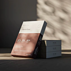 A skincare product box displays "calm & clear."