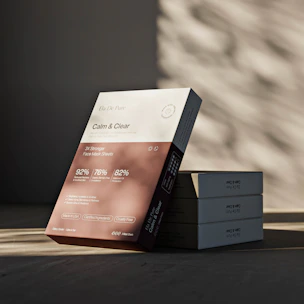 A skincare product box displays "calm & clear."