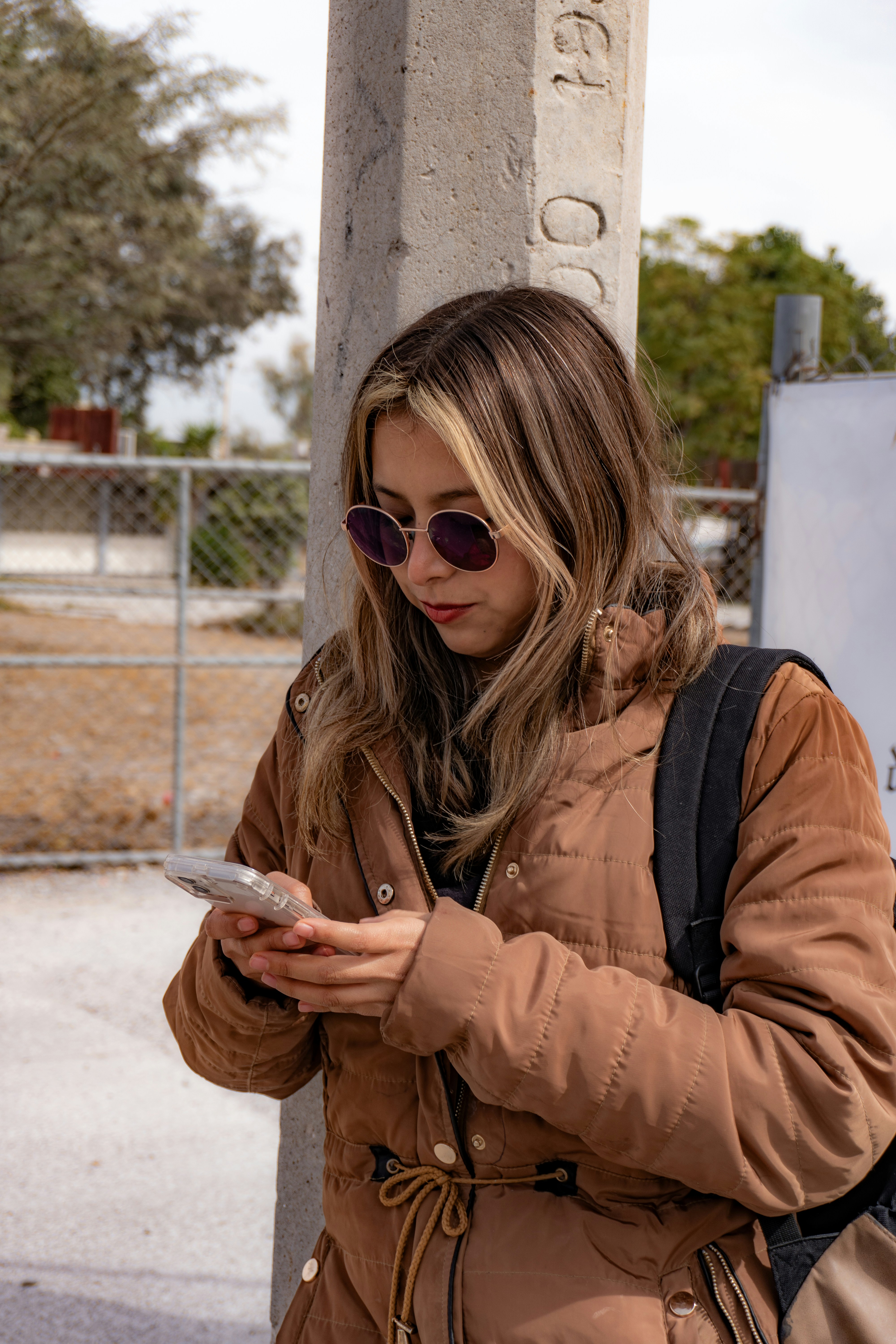 Teen using a financial app on a smartphone