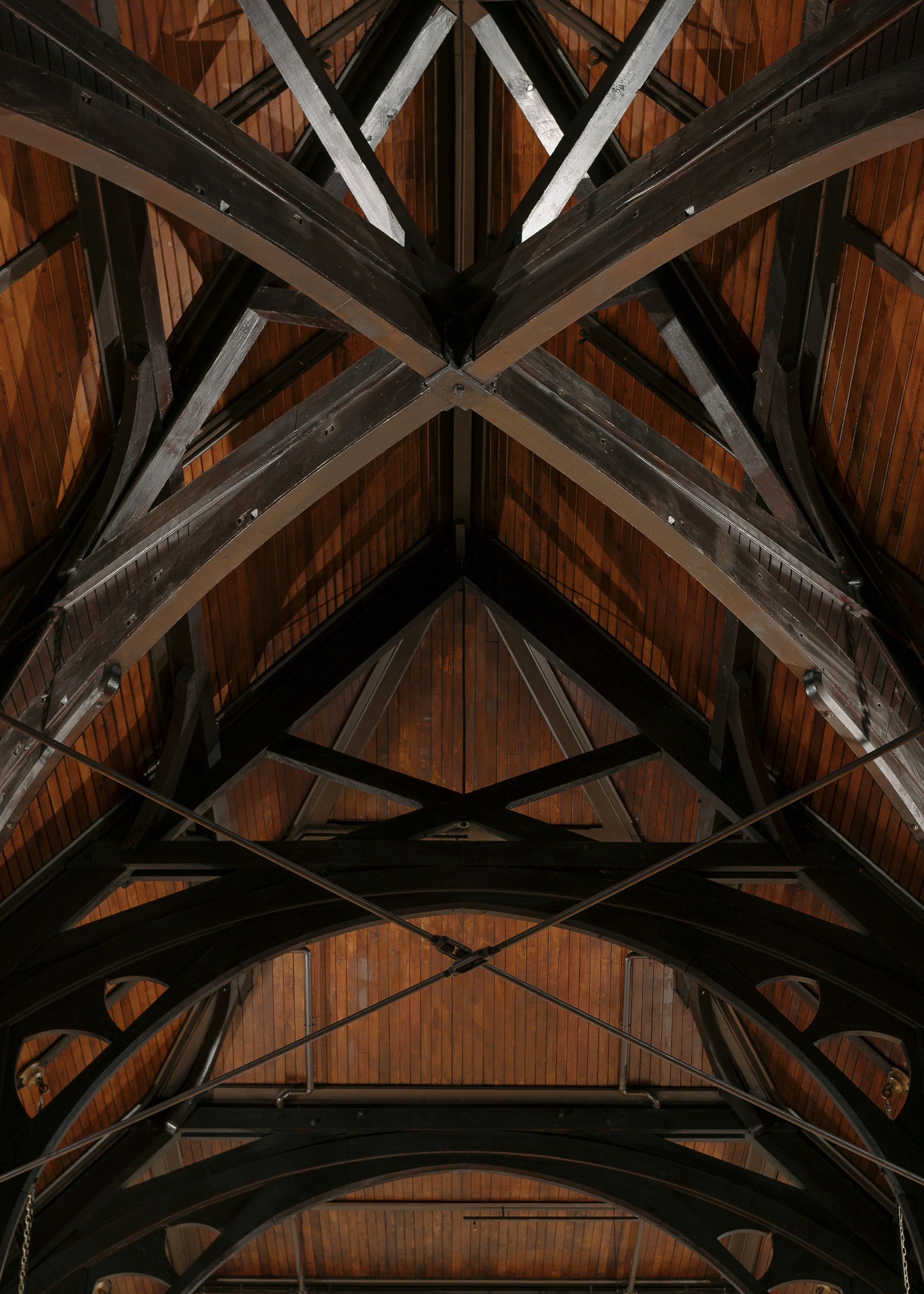 Wooden ceiling beams create an interesting, symmetrical design.