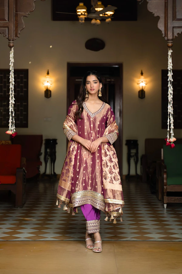 Woman wearing a designer kurtha