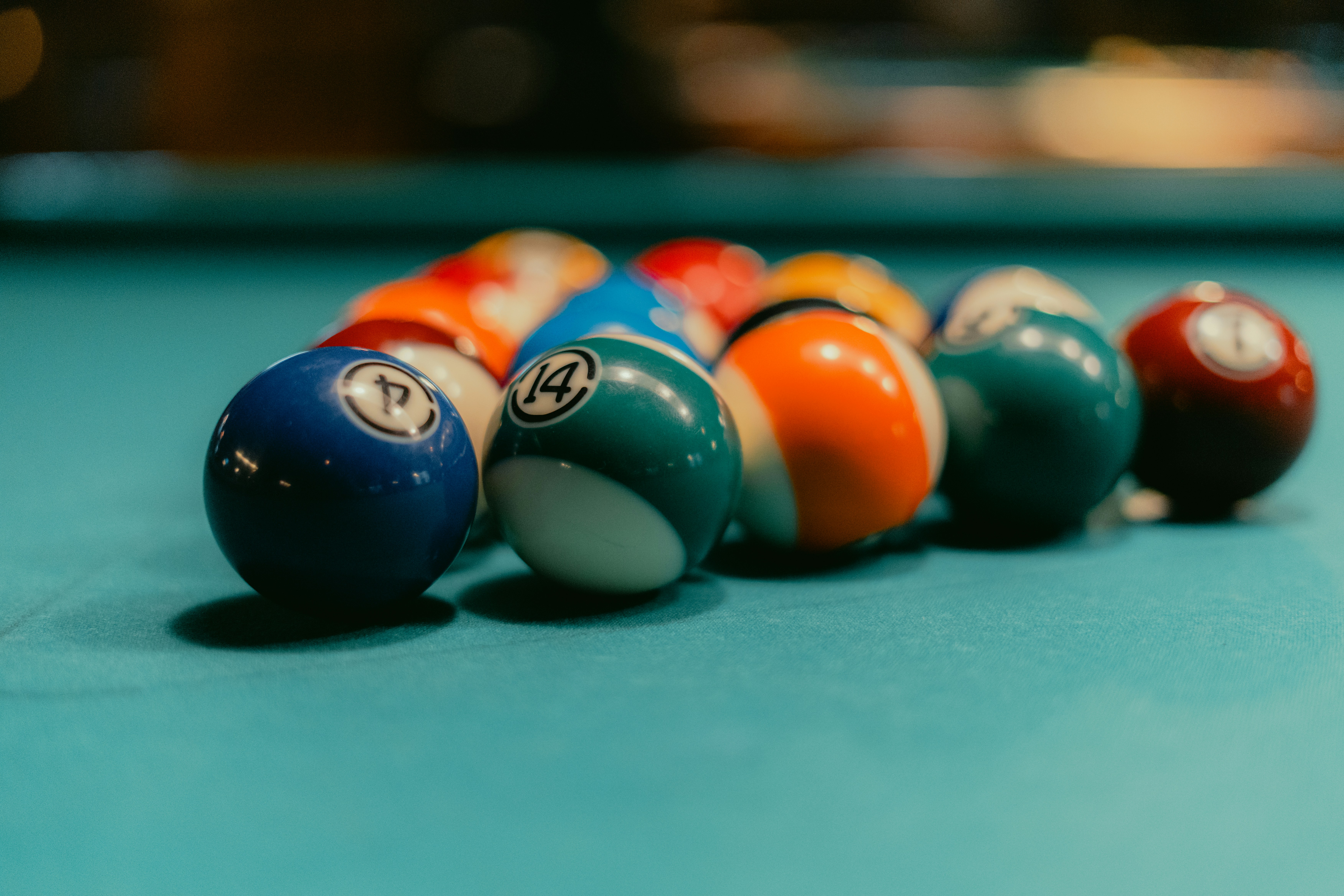 Pool balls are racked on a blue billiard table. photo – Free Furniture ...