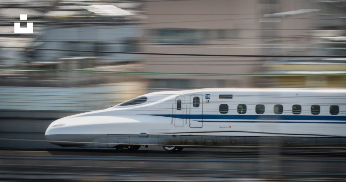 A fast-moving bullet train speeds past. photo – Free Train Image on ...