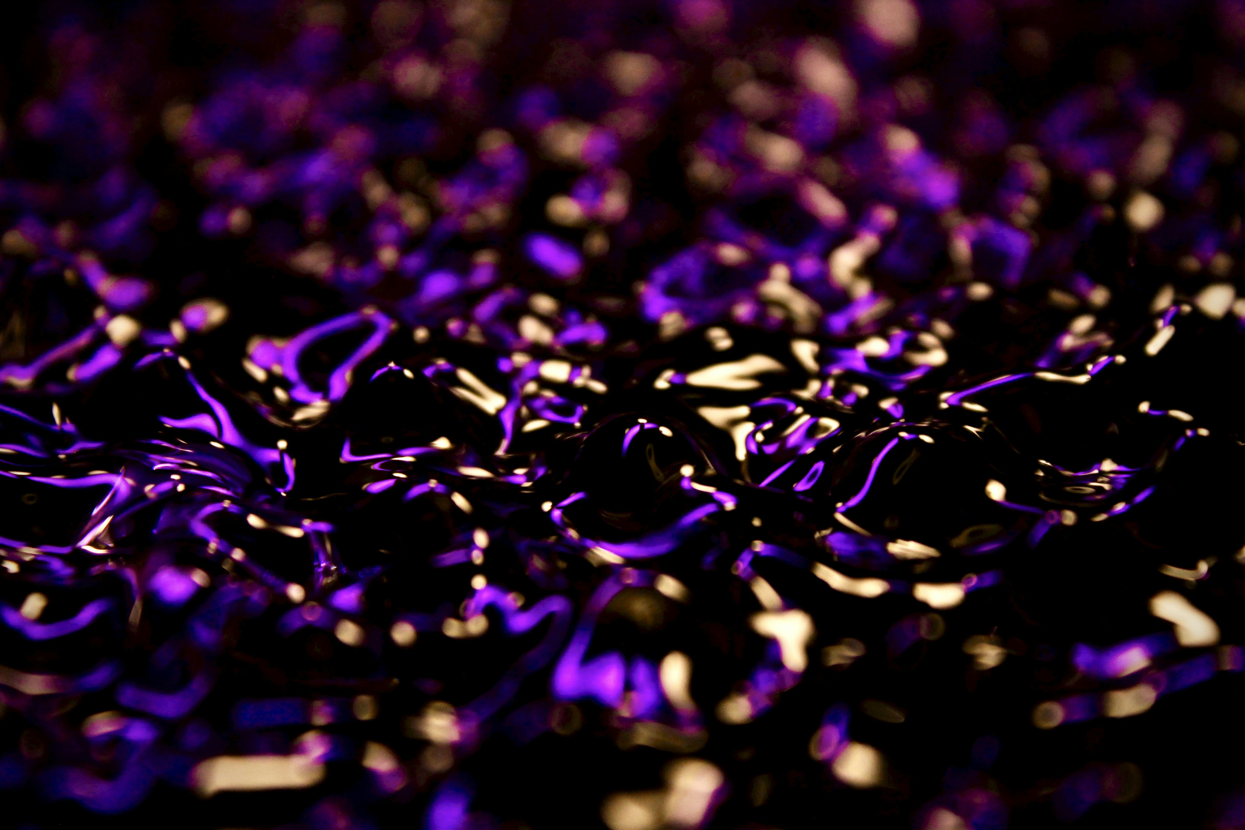 water vibrating with vibrant colors with a surreal vibe to it