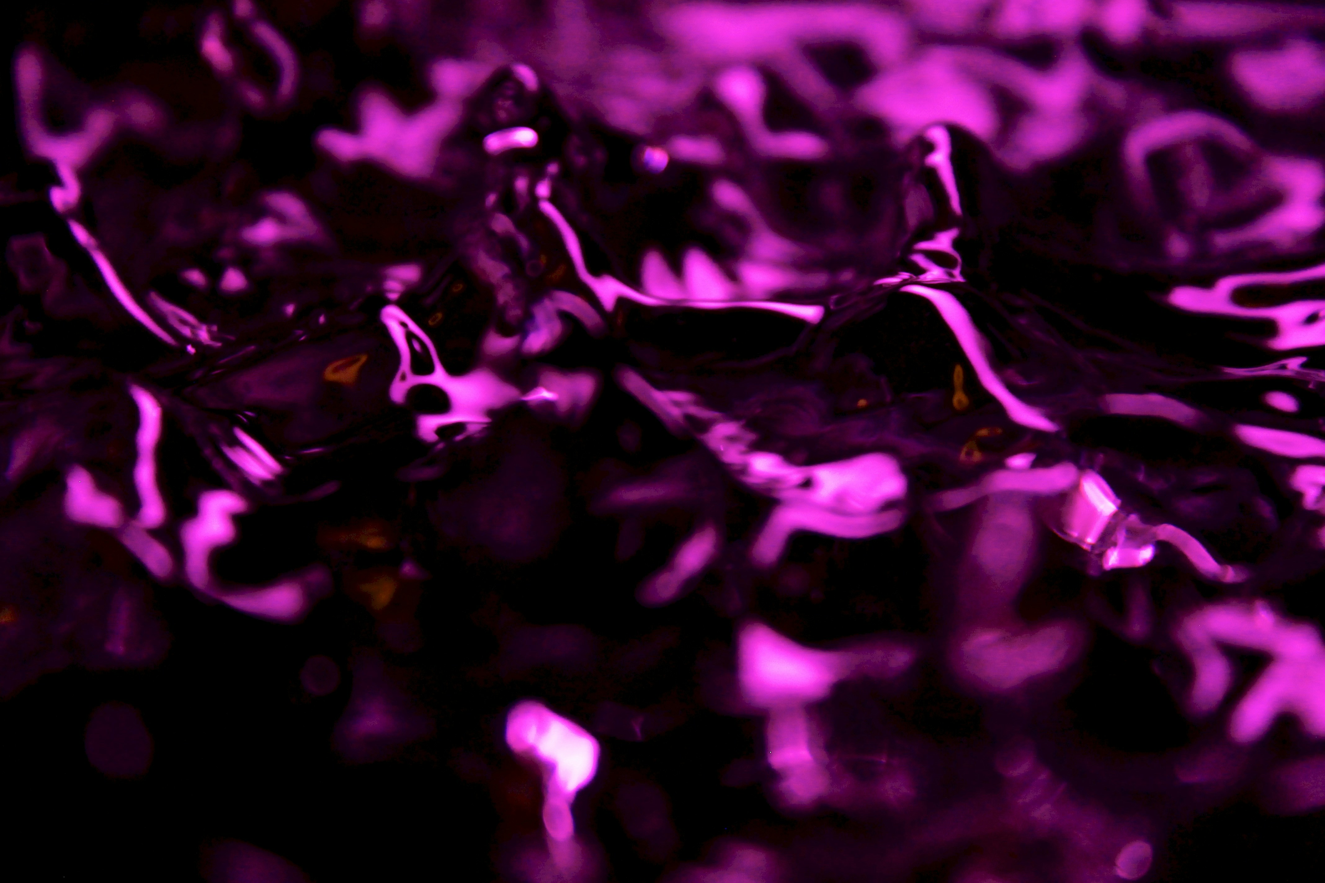 water vibrating with vibrant colors with a surreal vibe to it