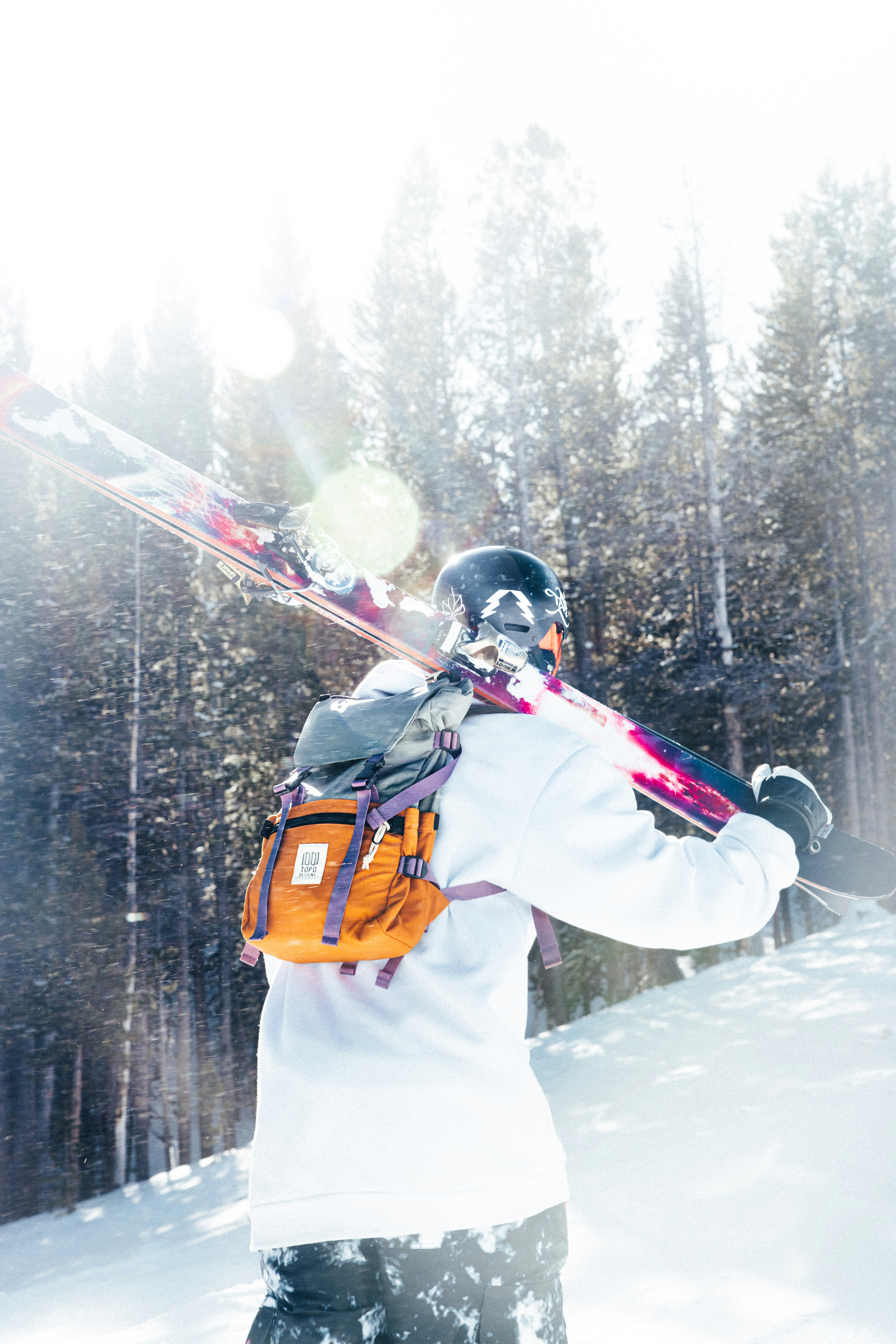 Skier walks through snow with skis over shoulder. photo – Free Forest ...