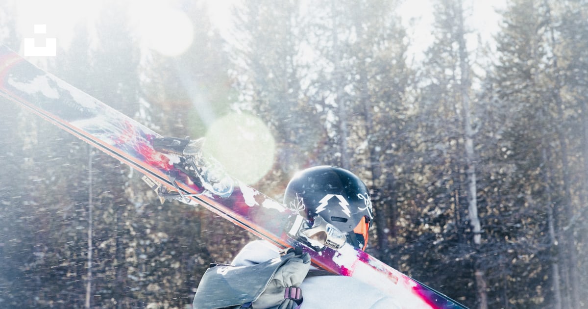 Skier walks through snow with skis over shoulder. photo – Free Forest ...