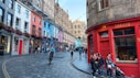 A colorful street scene in edinburgh, scotland.