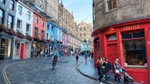 A colorful street scene in edinburgh, scotland.