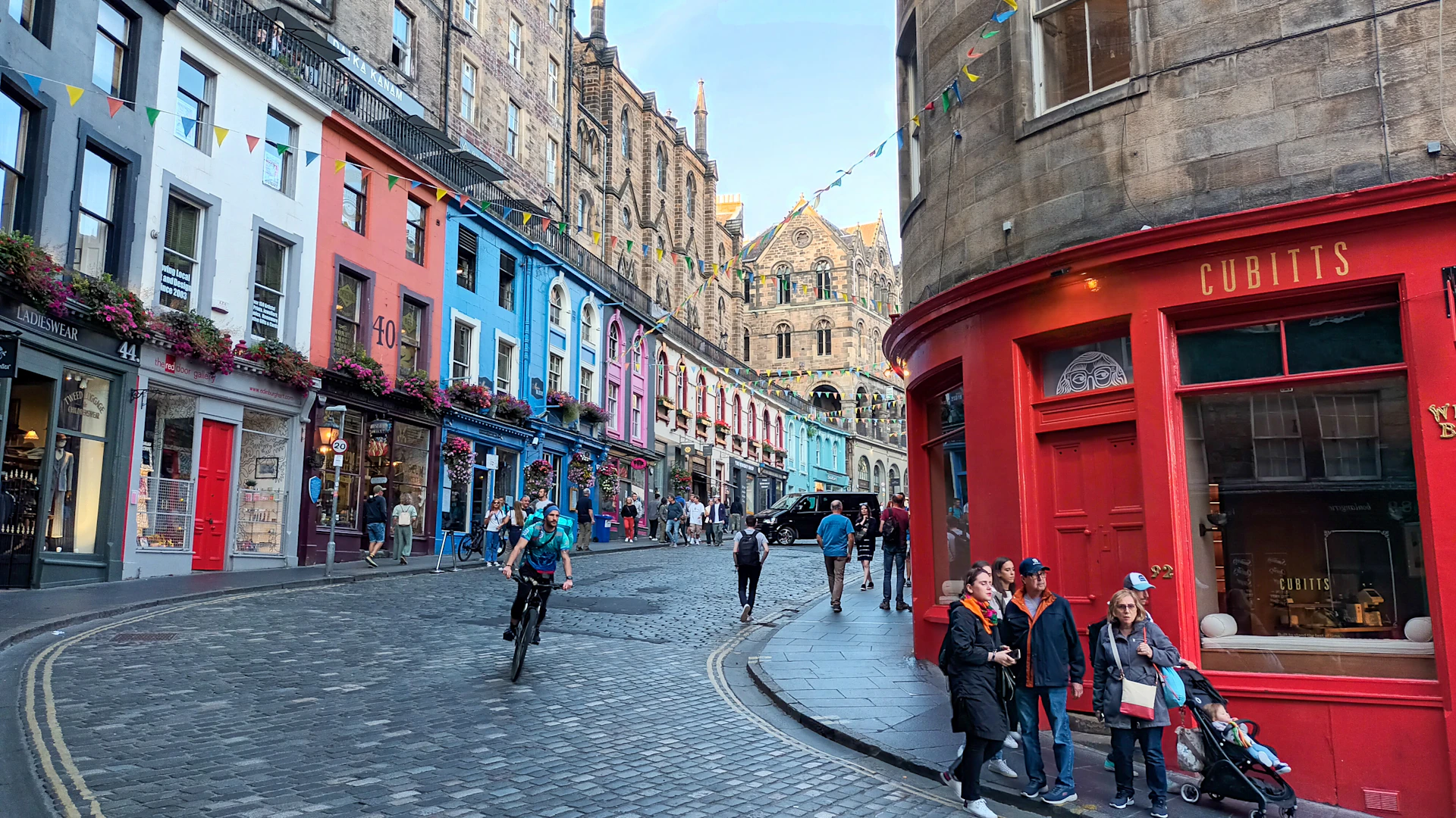A colorful street scene in edinburgh, scotland.