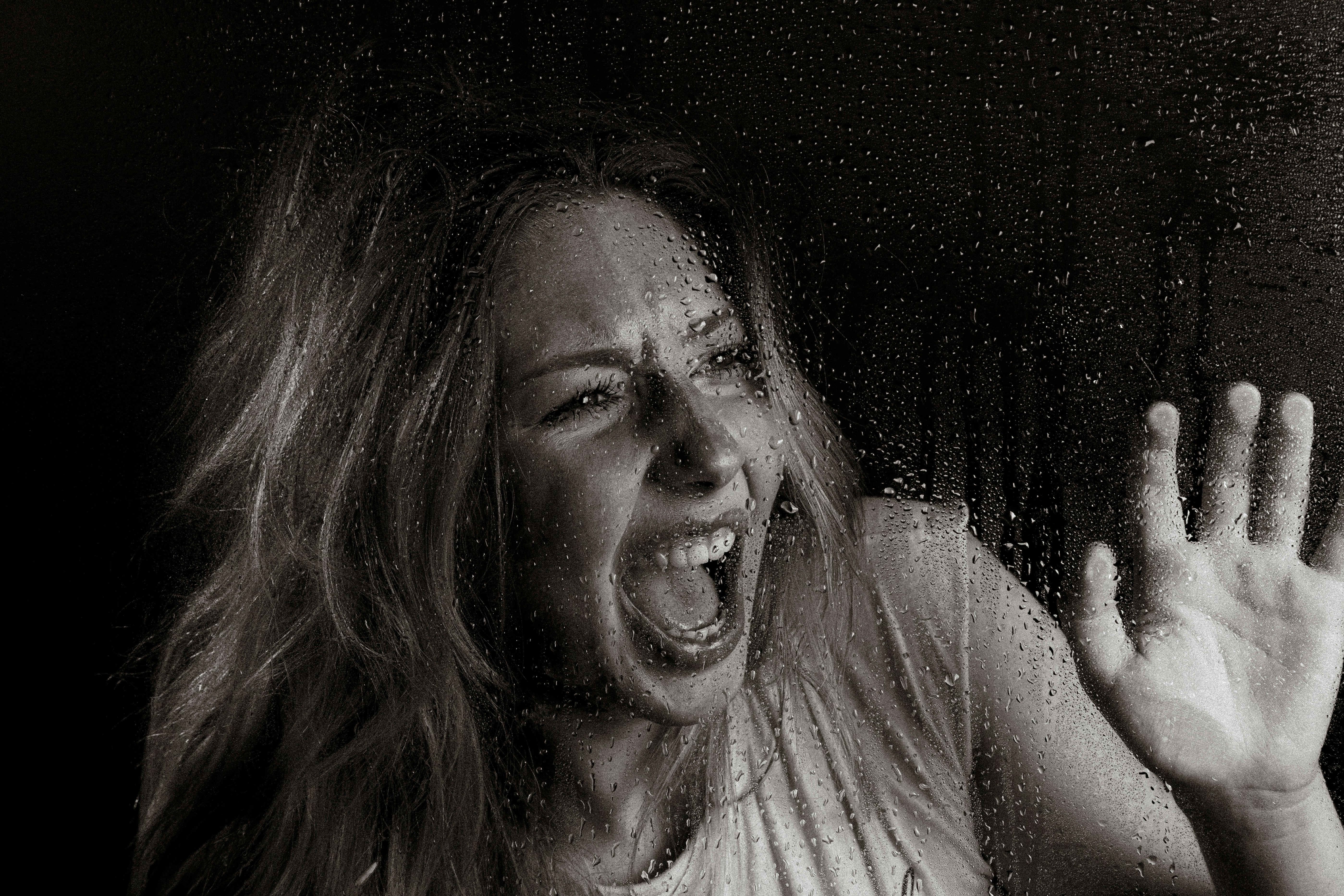 A woman screams in horror.