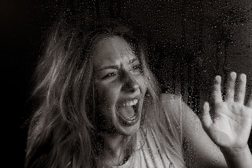 A woman screams in horror.