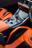 Luxurious, orange interior of a car.