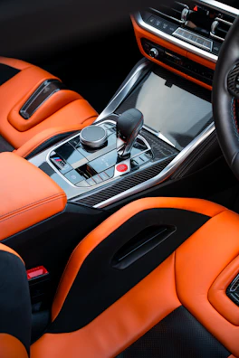 Luxurious, orange interior of a car.
