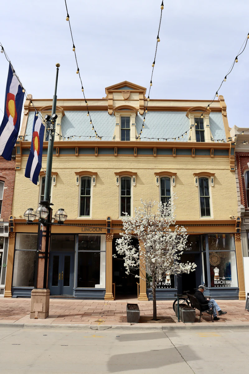 Historic building with streetlights along an urban sidewalk