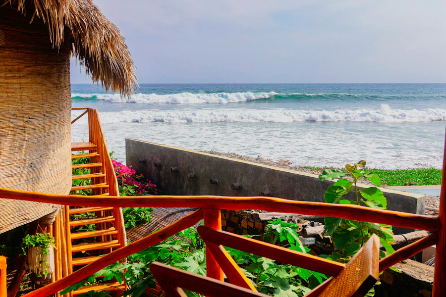Timber porch of a guesthouse looking out over the ocean