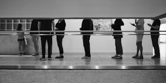 People are standing in a line, waiting.