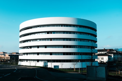 A modern round building with many floors.