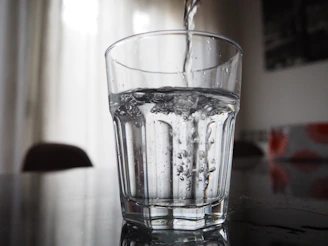 Water is being poured into a glass.