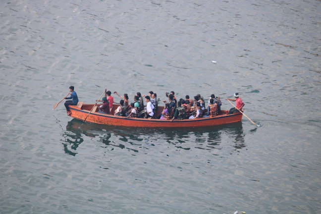 People are riding in a boat on the water