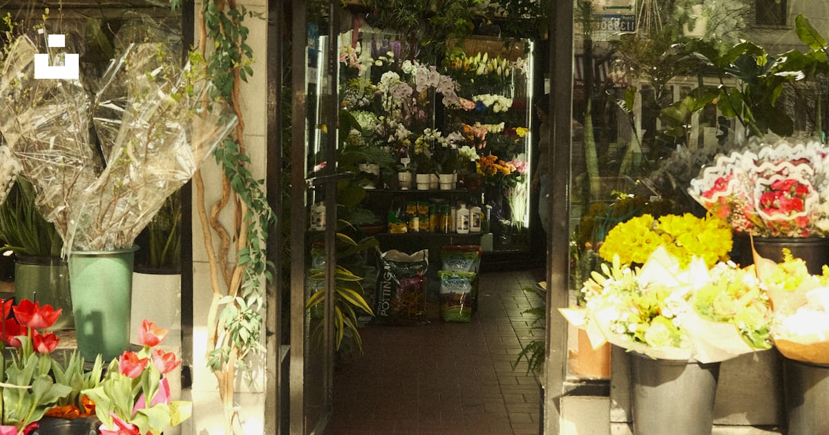 A beautiful flower shop entrance, filled with blooms. photo – Free ...
