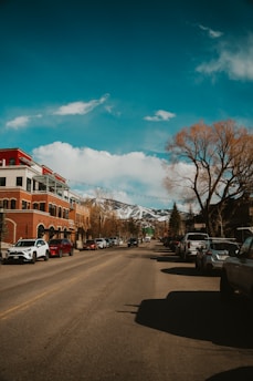 A street in a town with mountains in the distance.