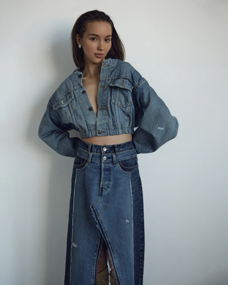 Woman modelling a denim jacket and skirt