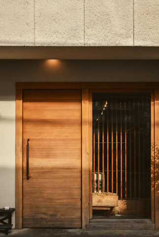 A wooden door with a glass and wood partition.