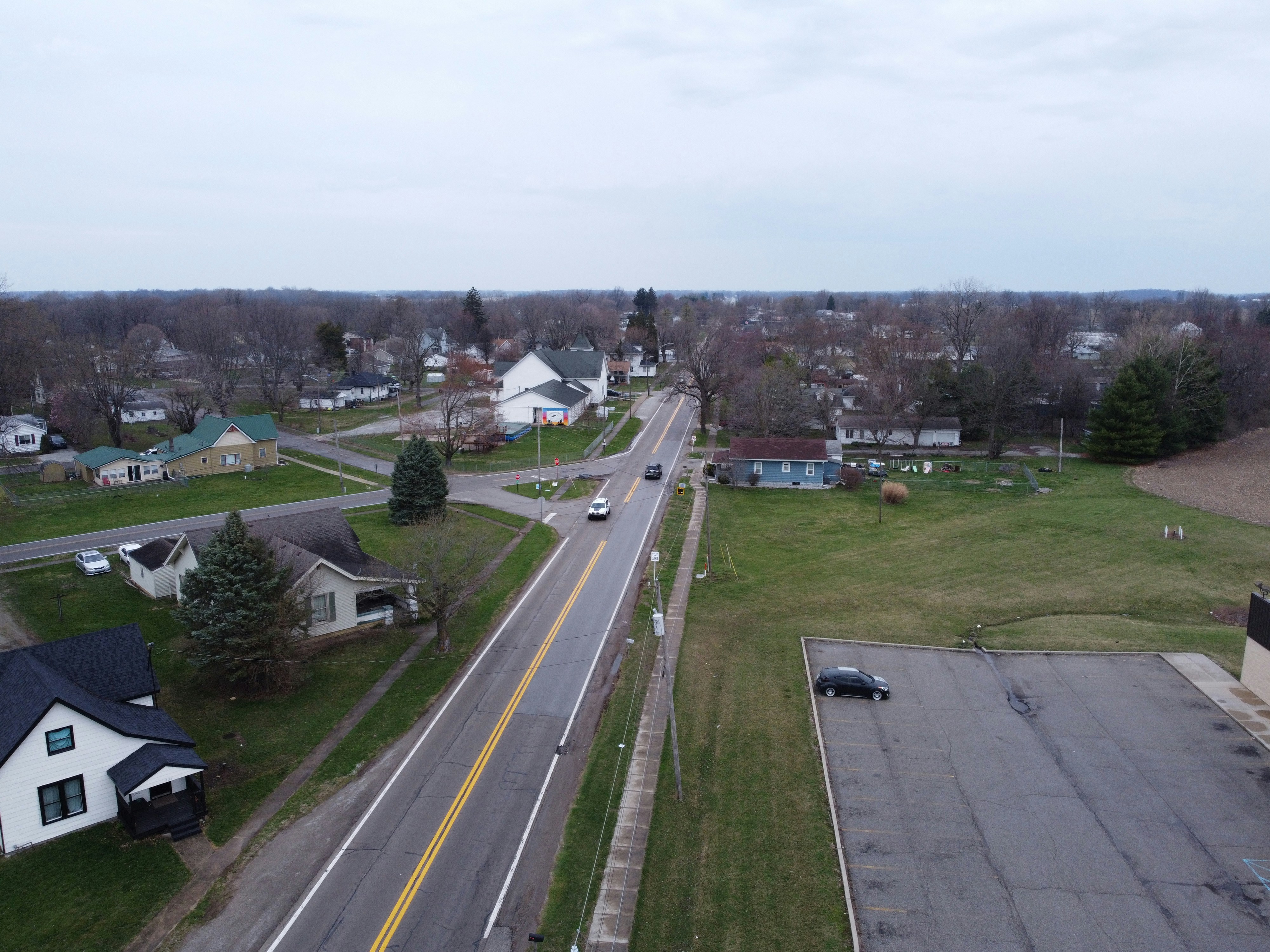 A street leads through a peaceful rural town.