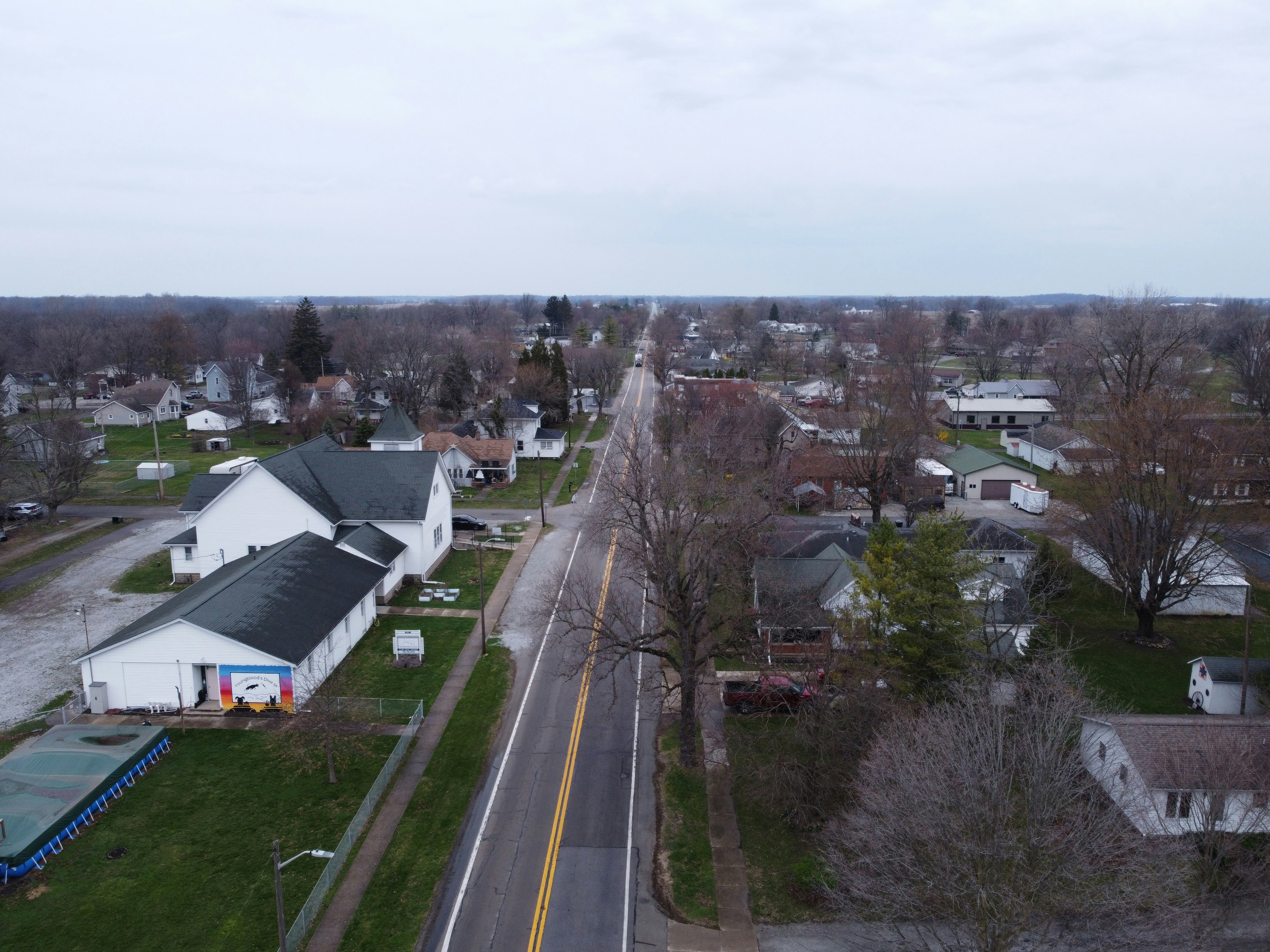 An aerial view of a quiet town street.